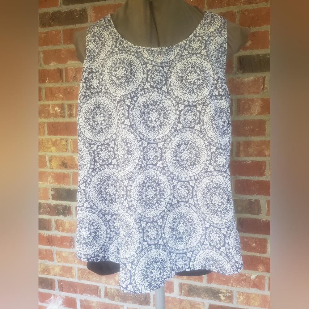A cute blue and white mandala print tank. 100% polyester size l 12-14.
